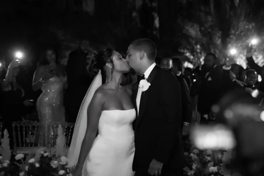 Black and white first kiss at a candlelit evening ceremony - wedding photographer Marrakech